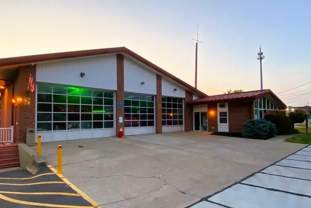 The brick Brunswick Hills fire station with glass bay doors at sunset in Brunswick Hills Township, Ohio