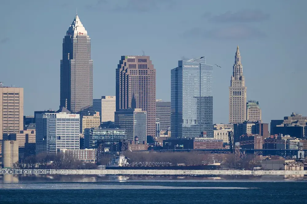 The downtown Cleveland skyline seen across the water from Lakewood Park in winter