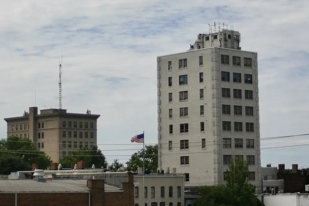 Downtown Elyria, Ohio buildings and a tall office tower under a cloudy sky