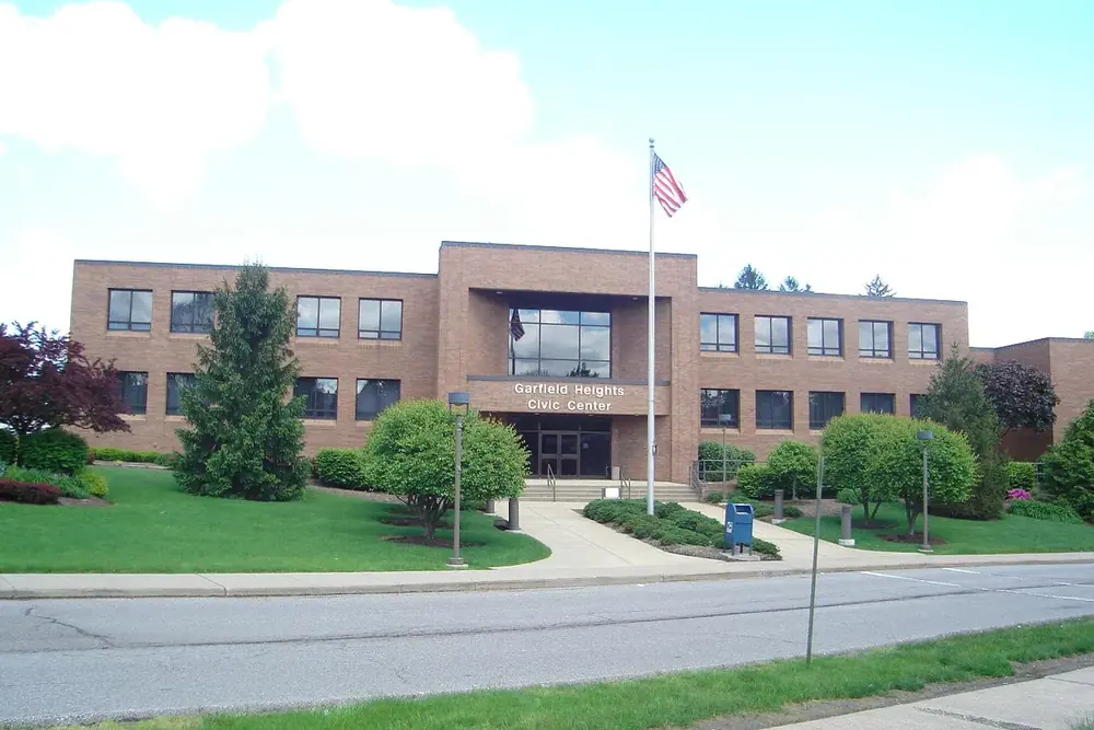The brick Garfield Heights civic center with a flagpole and lawn in Garfield Heights, Ohio