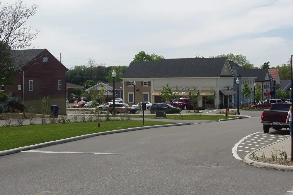 Historic white and brick buildings around a quiet street corner in Hudson, Ohio