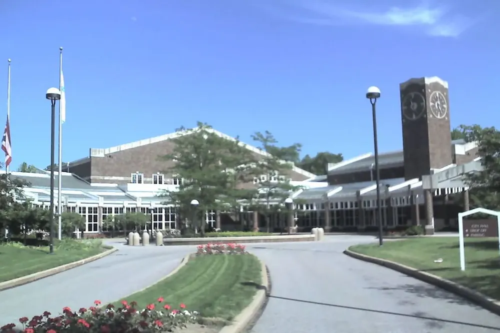 The Solon City Hall complex and its clock tower beyond a curving drive in Ohio