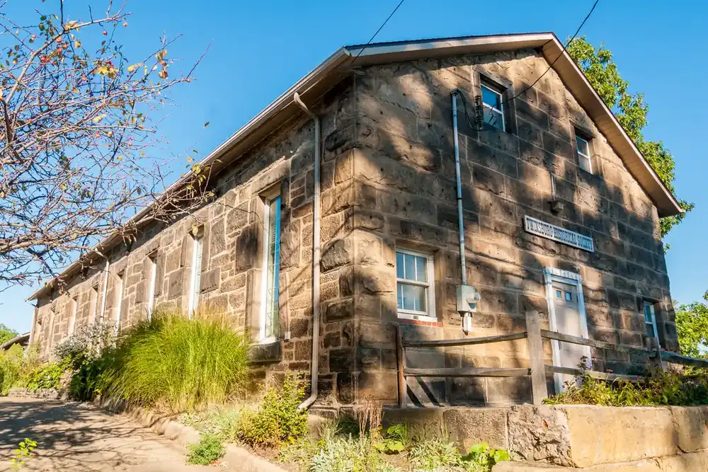 The sandstone Twinsburg Historical Society building in afternoon sun in Twinsburg, Ohio